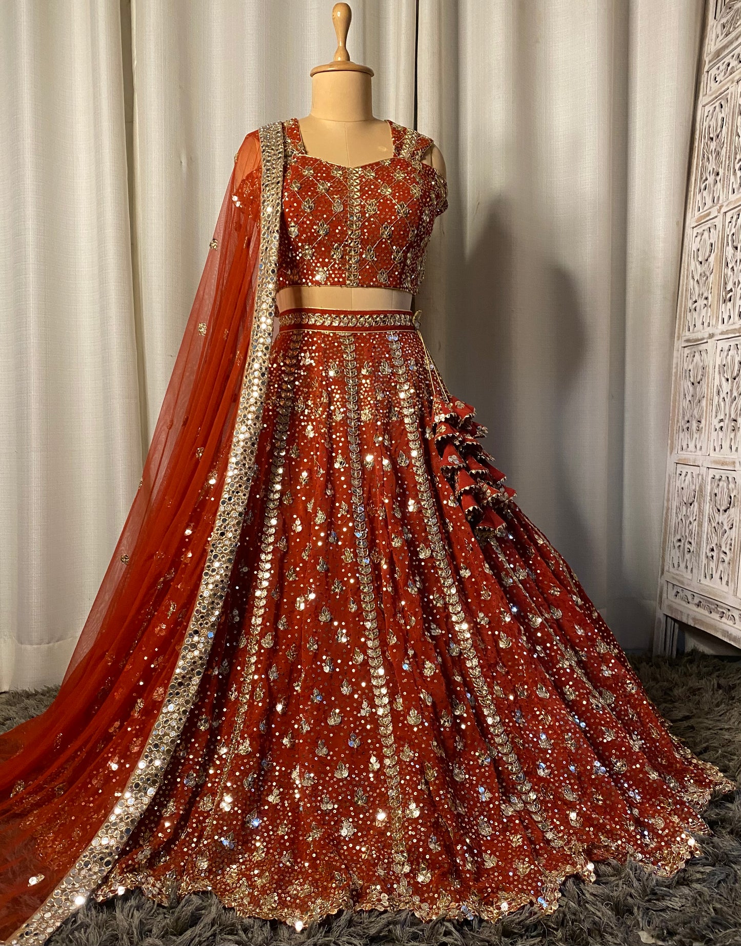 Rust hand embroidered bridal lehenga